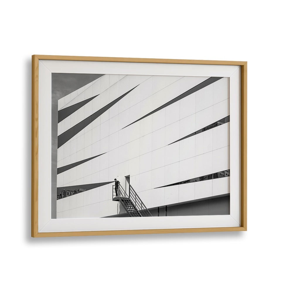 Framed UNTITLED IX, PHOTOGRAPHY PRINTS showcasing striking urban architecture and a figure on a staircase.