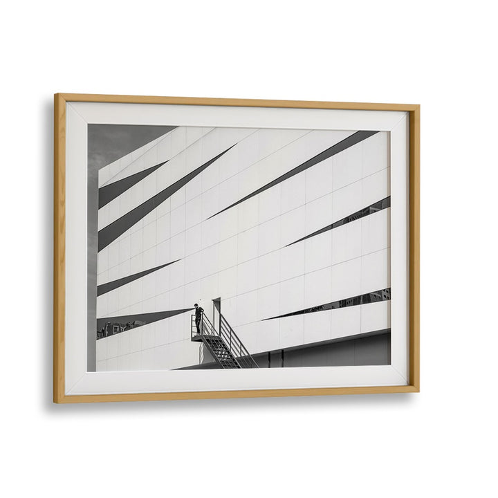 Framed UNTITLED IX, PHOTOGRAPHY PRINTS showcasing striking urban architecture and a figure on a staircase.