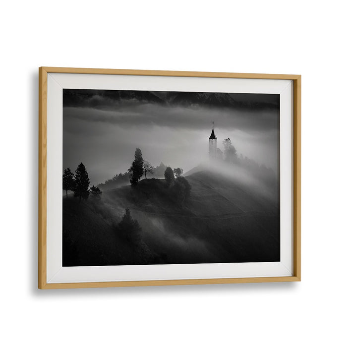 Serene landscape featuring a church shrouded in fog, perfect for OUT OF THE MIST, PHOTOGRAPHY PRINTS collection.