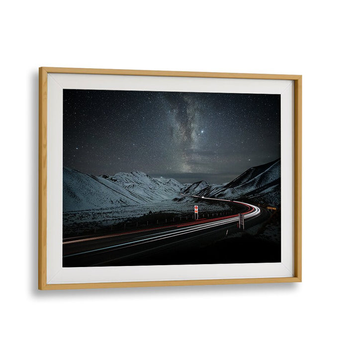 Stunning landscape of a winding road under a starry sky, perfect for your decor with HIGHWAY TO HEAVEN, PHOTOGRAPHY PRINTS.