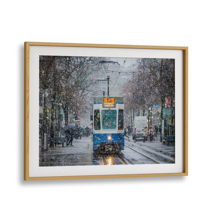 Tram in a snowy Zurich street captures the essence of "Morning in Zurich, Photography Prints." Perfect for art lovers.