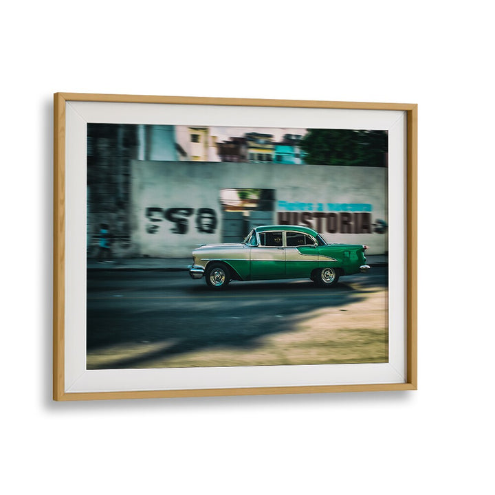 Urban street scene showcasing a classic car, representing THE HISTORY OF , PHOTOGRAPHY PRINTS. Perfect for art lovers.