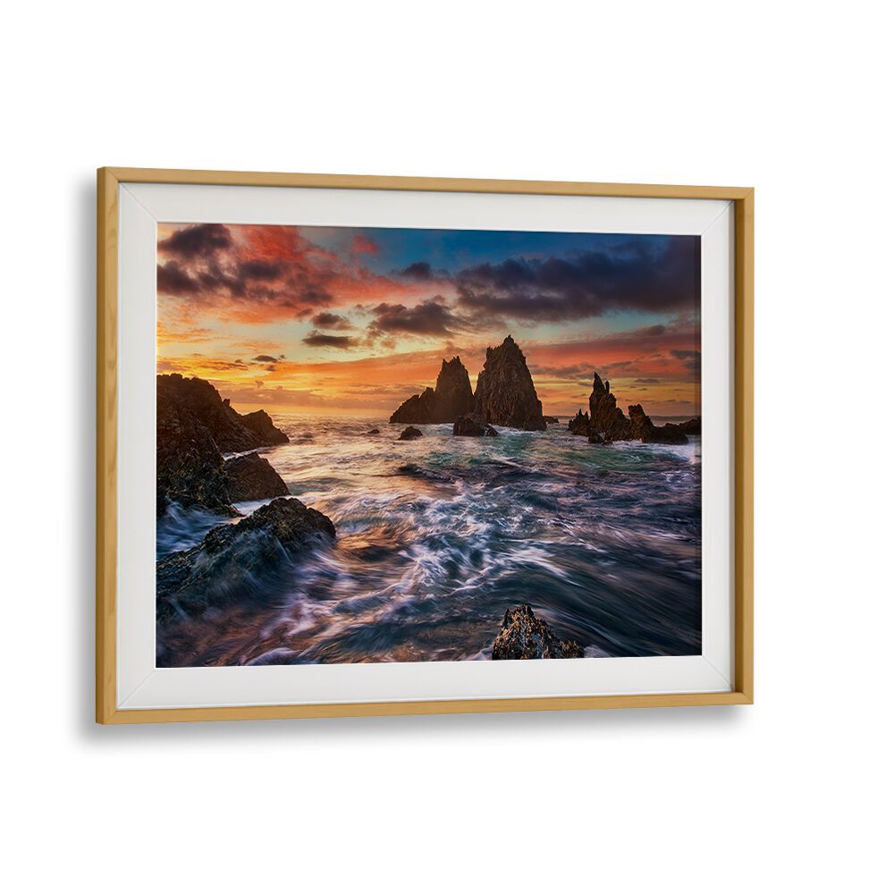 Stunning DANCE WITH LIGHT, PHOTOGRAPHY PRINTS showcasing a vibrant sunset over rugged coastal rocks. Perfect for decor!