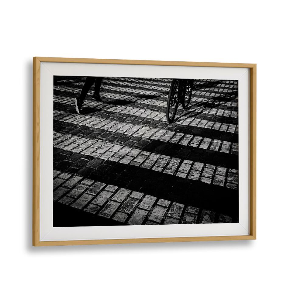Stylish RUN A BIKE, PHOTOGRAPHY PRINTS showcasing biking on cobblestone, perfect for art and adventure lovers.