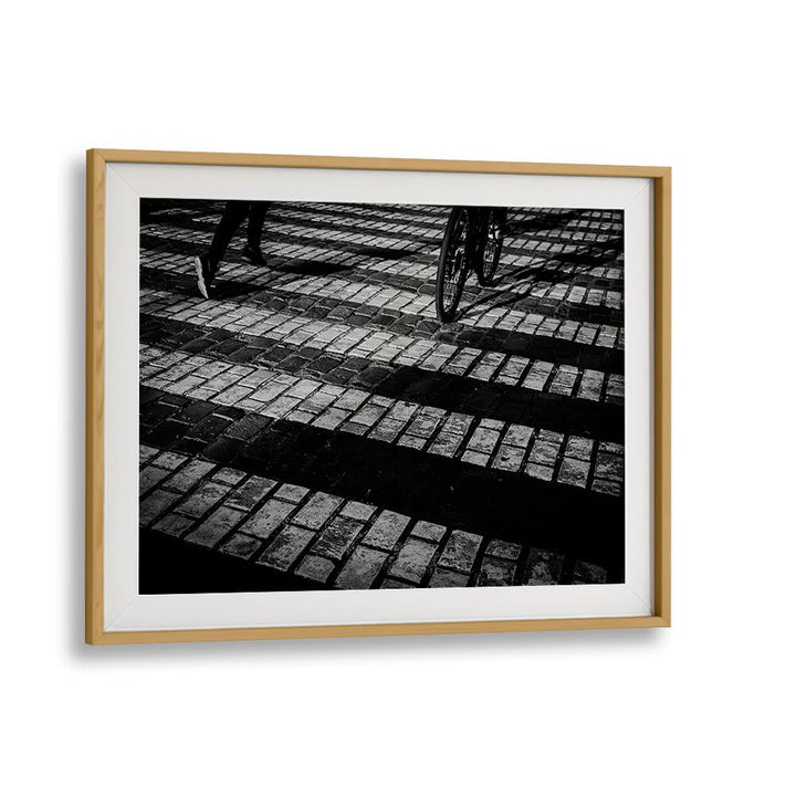 Stylish RUN A BIKE, PHOTOGRAPHY PRINTS showcasing biking on cobblestone, perfect for art and adventure lovers.
