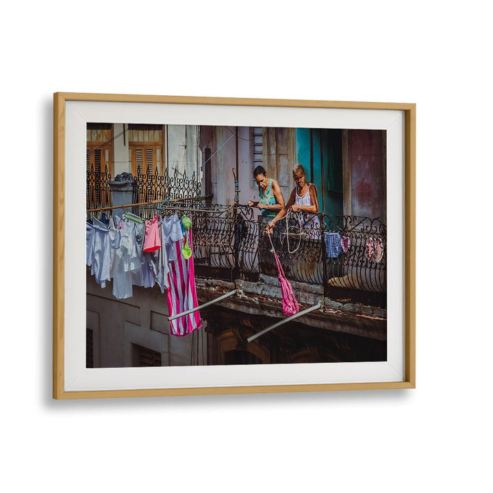 Street scene captured in "SHOPPING FROM THE BALCONY, PHOTOGRAPHY PRINTS," showcasing urban life and vibrant stories.