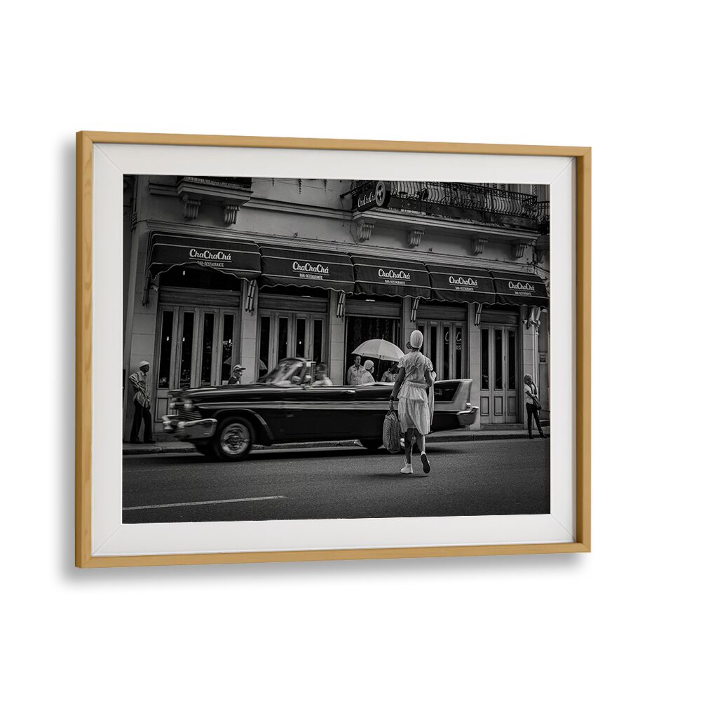 Explore urban life with HABANA STREET XI, PHOTOGRAPHY PRINTS, showcasing a timeless scene of classic cars and street culture.