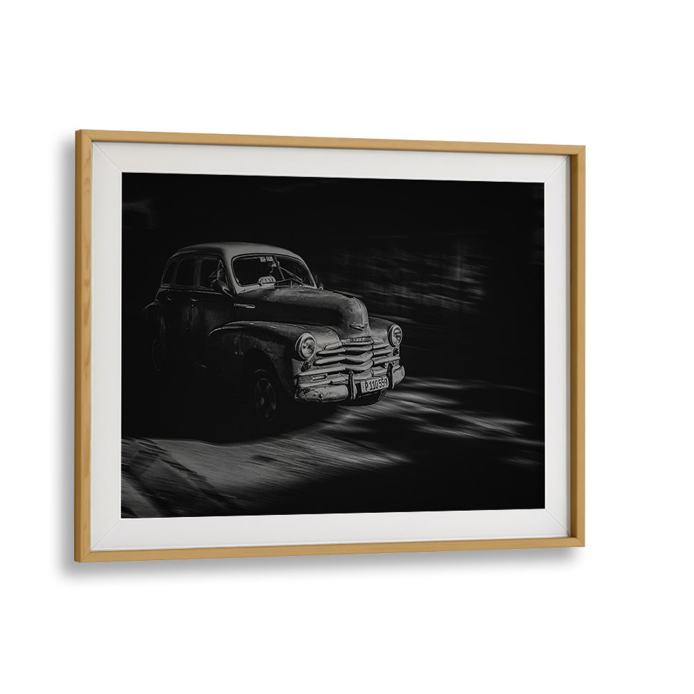 Vintage car driving through Havana, featured in HAVANA STREET I, PHOTOGRAPHY PRINTS, showcasing urban life and culture.