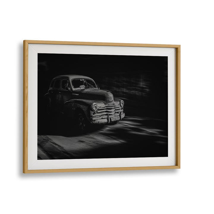 Vintage car driving through Havana, featured in HAVANA STREET I, PHOTOGRAPHY PRINTS, showcasing urban life and culture.