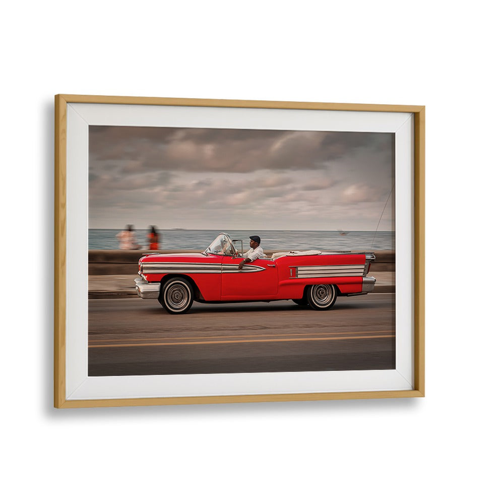 Classic red convertible cruising along the Malecon, featured in MALECON IX, PHOTOGRAPHY PRINTS for urban art lovers.