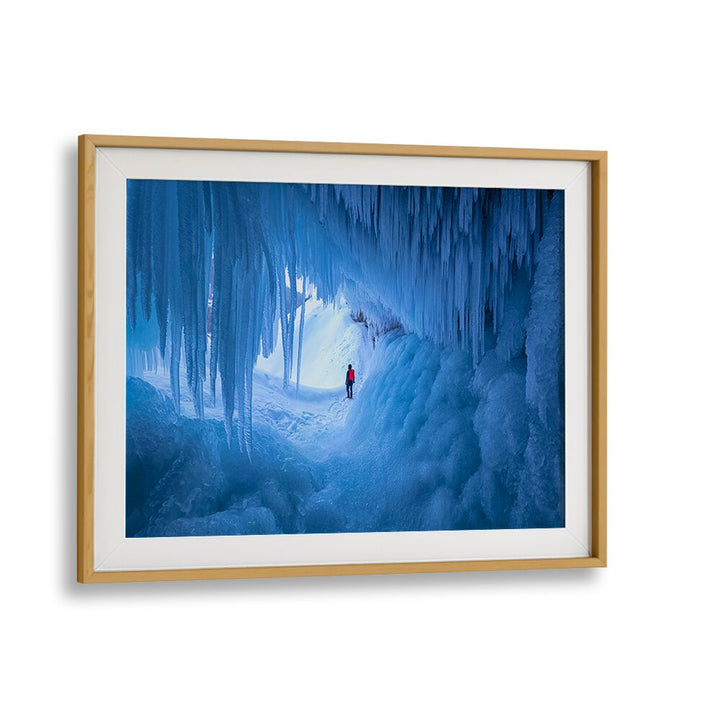 Transform your space with CAVE OF ICE, PHOTOGRAPHY PRINTS featuring a stunning frozen landscape in serene blue hues.