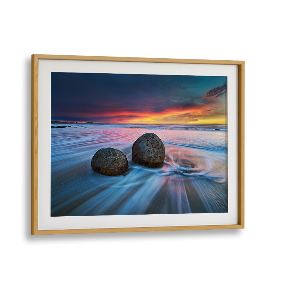 Experience stunning MOERAKI BOULDERS, PHOTOGRAPHY PRINTS showcasing unique geological formations and vibrant sunsets.