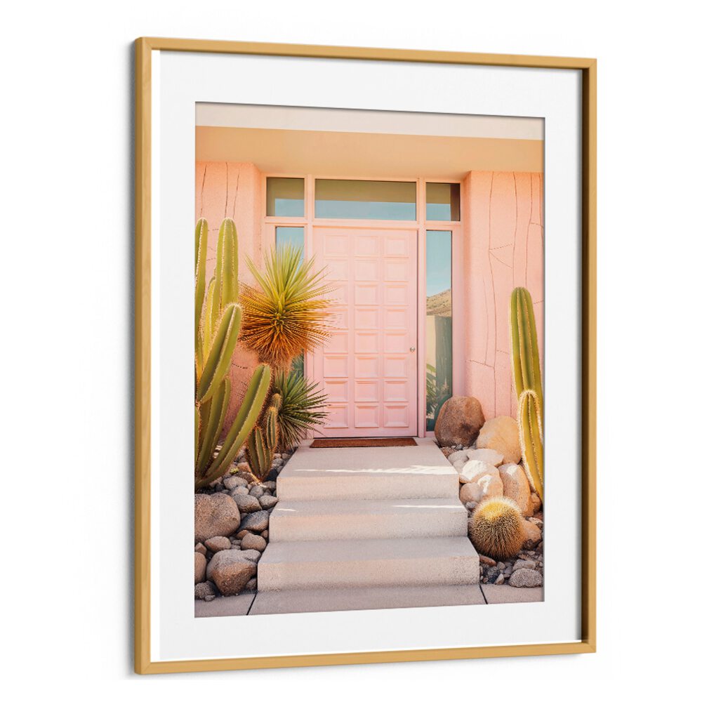 PINK MID-CENTURY, BEACH PAINTINGS highlight chic design with a vibrant pink door and desert landscaping by Philippe Hugonnard.