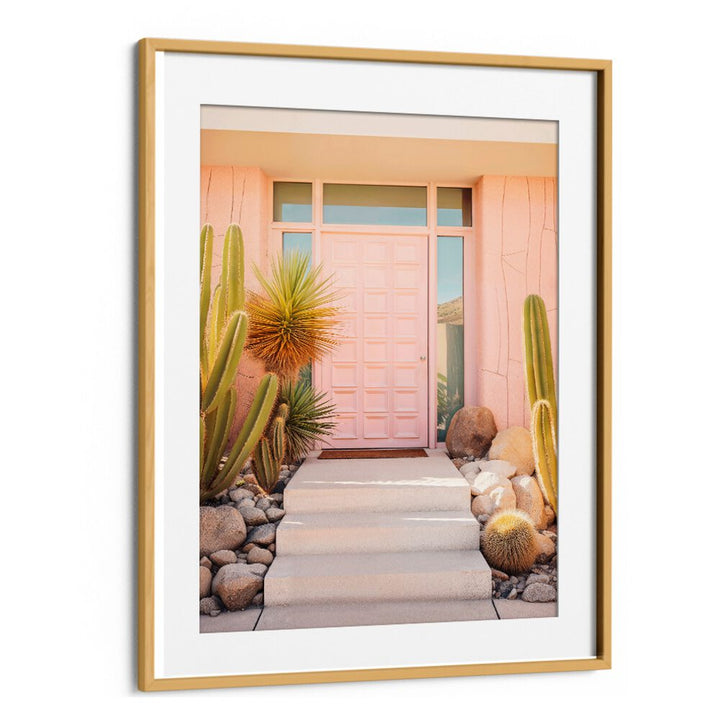 PINK MID-CENTURY, BEACH PAINTINGS highlight chic design with a vibrant pink door and desert landscaping by Philippe Hugonnard.