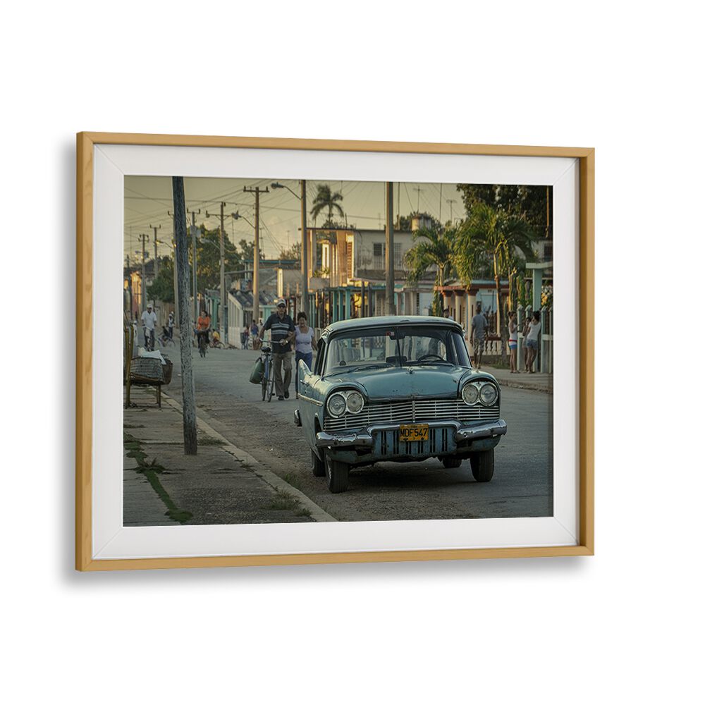 Vibrant street scene featuring a classic car, part of our STREET LIFE, PHOTOGRAPHY PRINTS collection.