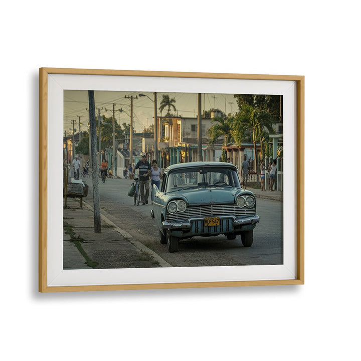 Vibrant street scene featuring a classic car, part of our STREET LIFE, PHOTOGRAPHY PRINTS collection.