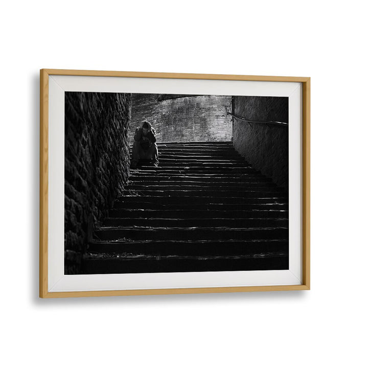 Emotional scene of solitude captured in "IN DESPAIR, PHOTOGRAPHY PRINTS," reflecting urban life's depth and story.