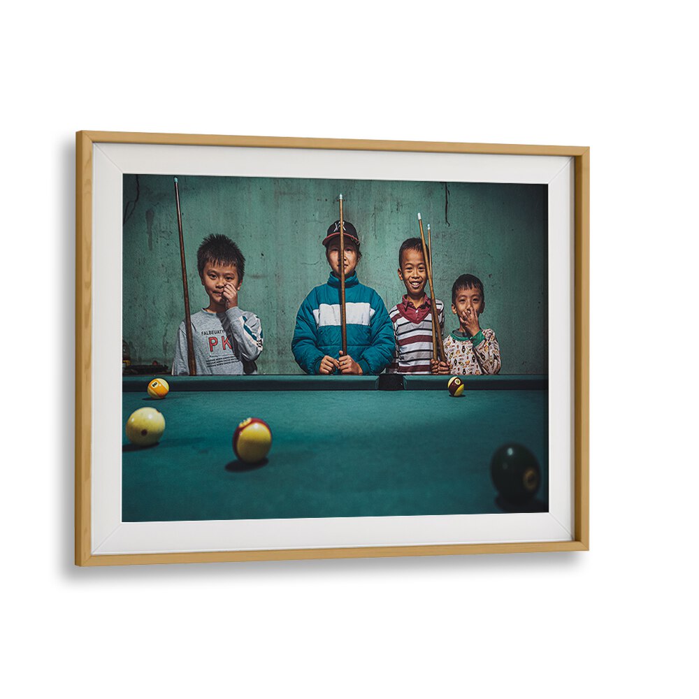 Captivating scene of kids playing snooker indoors, featured in PLAYING SNOOKER IN THE MOUNTAINS, PHOTOGRAPHY PRINTS.