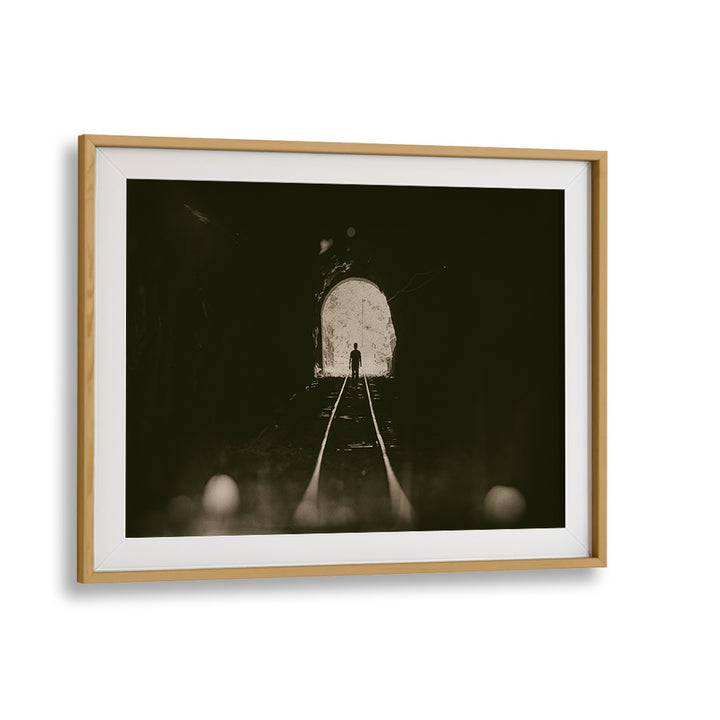 Framed TOWARDS THE LIGHT, PHOTOGRAPHY PRINTS showcasing a figure emerging from a dark tunnel into bright light.