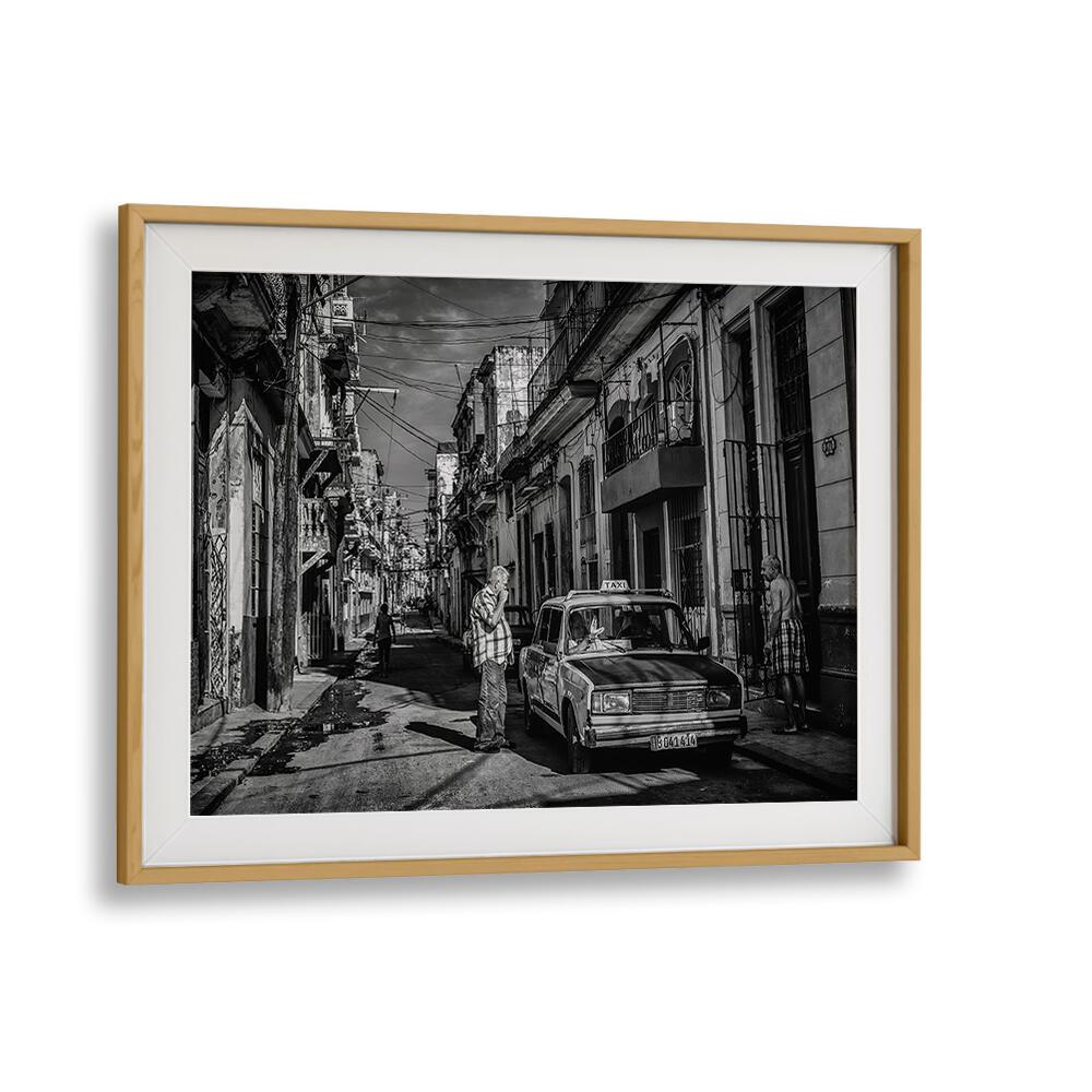 Black-and-white street scene featuring a vintage taxi, from the HABANA STREET VII, PHOTOGRAPHY PRINTS collection.