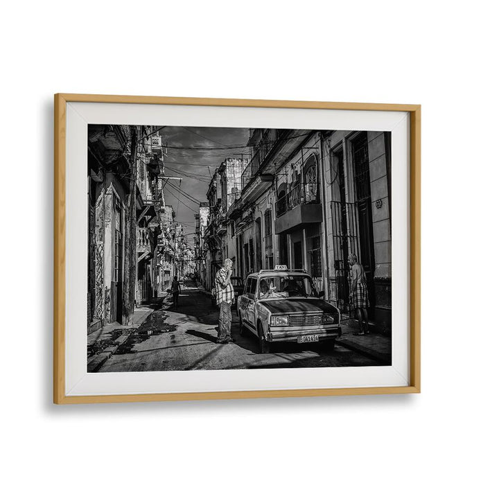 Black-and-white street scene featuring a vintage taxi, from the HABANA STREET VII, PHOTOGRAPHY PRINTS collection.