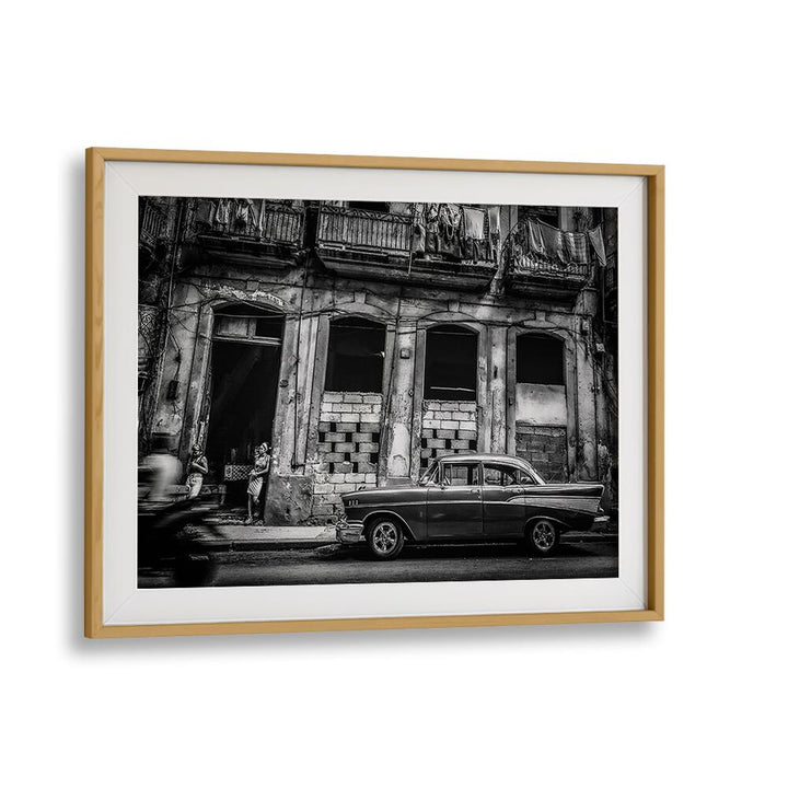 Elegant black and white photography print showcasing urban life on Habana Street, capturing its vibrant essence.