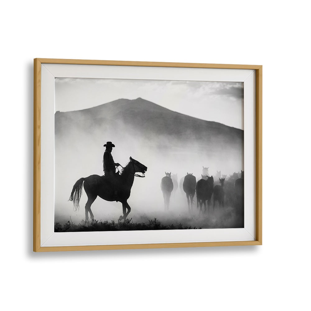 Silhouetted cowboy on horseback leads a herd, showcasing "HIS TERRITORY! , PHOTOGRAPHY PRINTS" in stunning black and white.