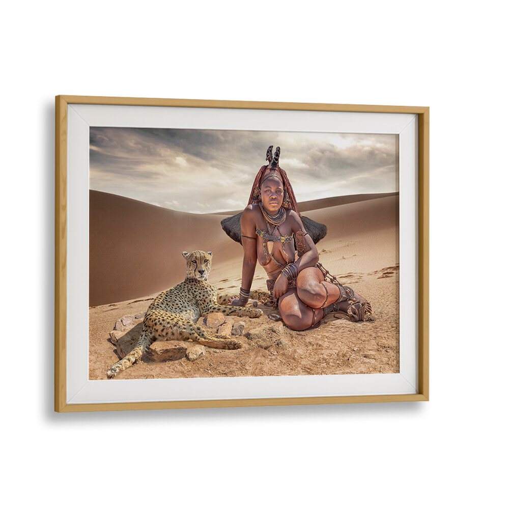 Himba Friends photography prints showcase a woman and leopard in stunning desert scenery, capturing nature's beauty.