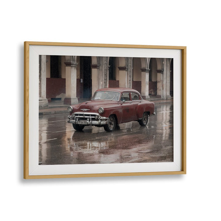 Classic car parked on a rainy street, showcasing urban beauty in DRIVING BY RAIN, PHOTOGRAPHY PRINTS collection.