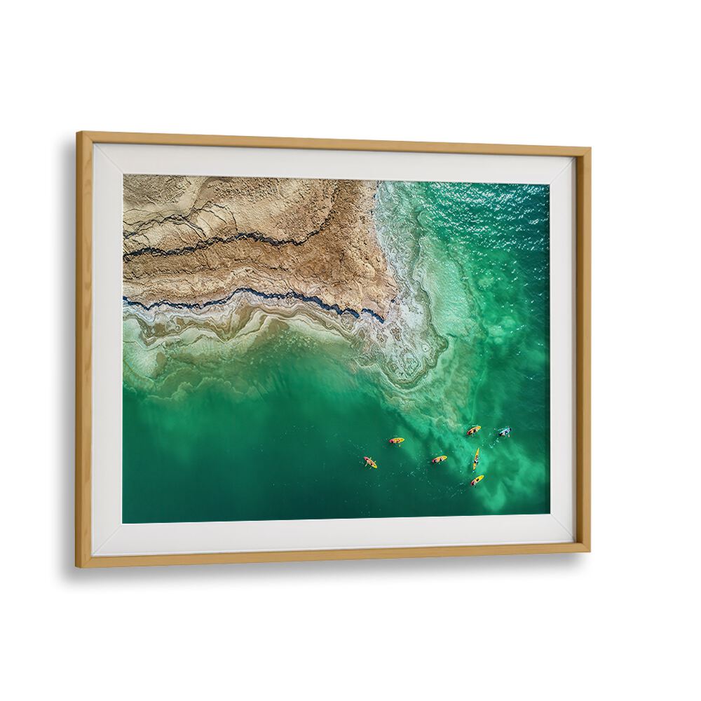 Stunning aerial view of the Dead Sea, showcasing vibrant kayakers in our DEAD SEA EXPLORATION, PHOTOGRAPHY PRINTS.