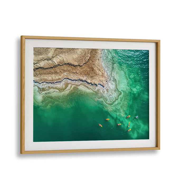 Stunning aerial view of the Dead Sea, showcasing vibrant kayakers in our DEAD SEA EXPLORATION, PHOTOGRAPHY PRINTS.