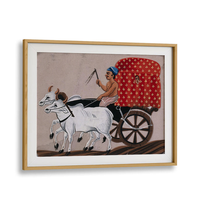 A MAN DRIVING A BULLOCK