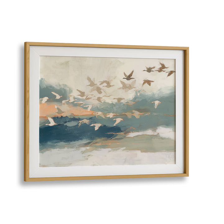 BIRDS IN FLIGHT AT DUSK OVER OPEN WATER