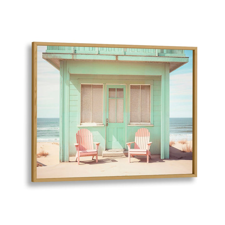 Pastel Perspectives beach paintings showcase a serene coastal scene with vibrant pink chairs and a charming mint cottage.