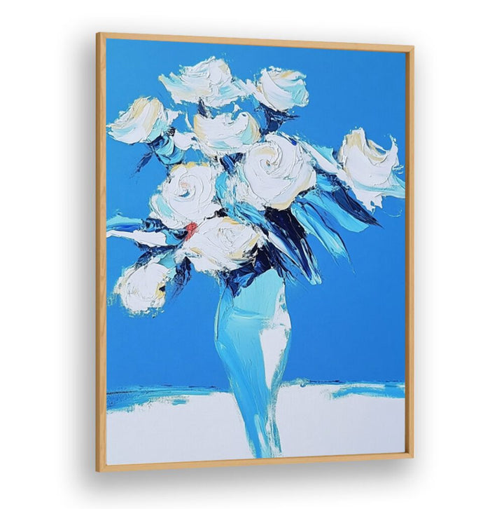 Stunning white roses in a blue vase, perfect for elevating your home decor with elegance and charm.