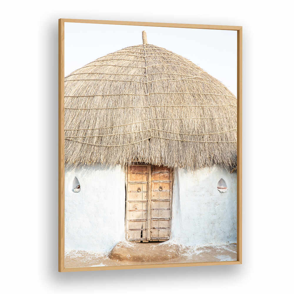 THATCHED HAVEN , INDIAN ART PAINTINGS Oakwood framed print of a rustic thatched hut with wooden door on a whitewashed wall