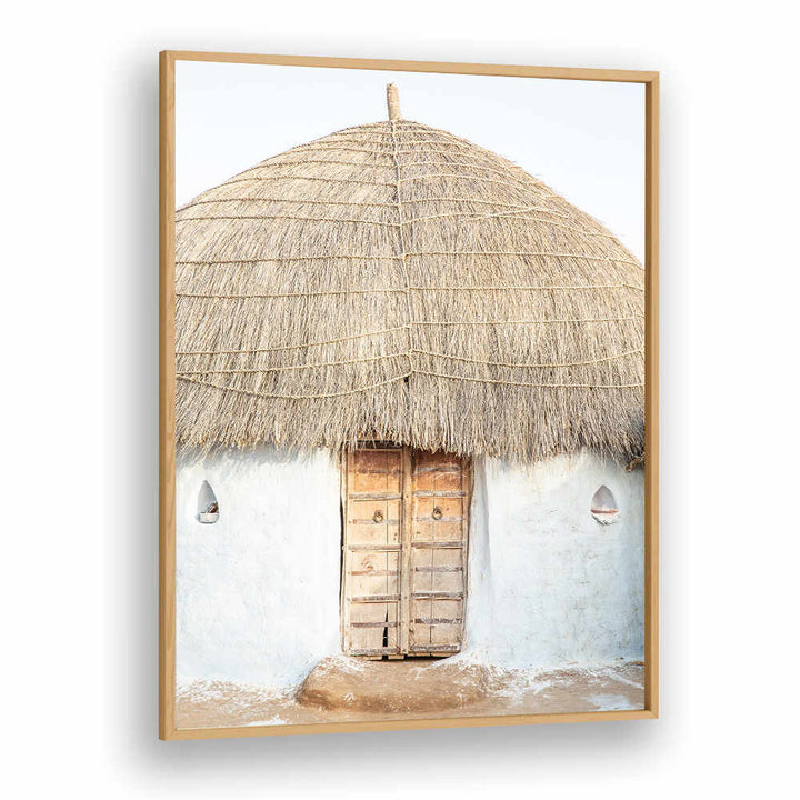 THATCHED HAVEN , INDIAN ART PAINTINGS Oakwood framed print of a rustic thatched hut with wooden door on a whitewashed wall