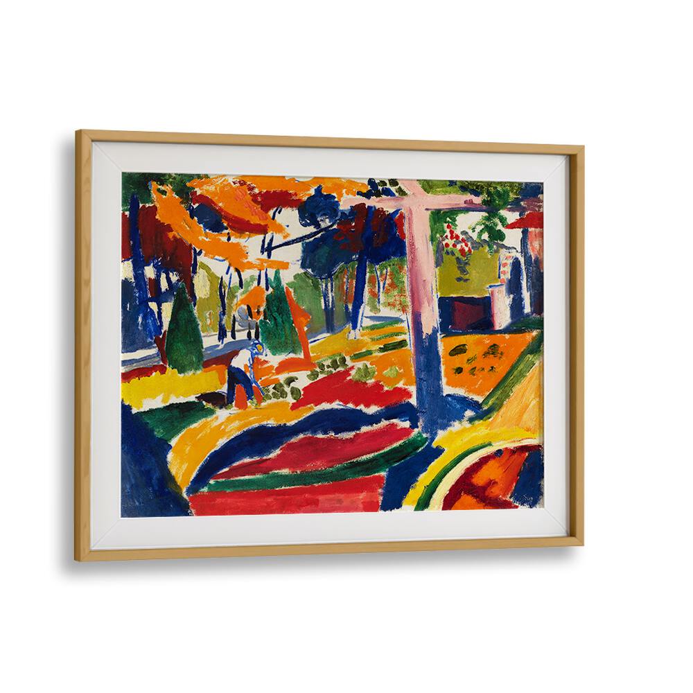 Asianmonk's "GARDEN (CA.1915), VINTAGE PAINTINGS" is a striking piece that echoes the dynamic style of Henry Lyman Saÿen, characterized by its bold use of color. It portrays a garden scene with trees, a figure, and fluid forms in vibrant red, blue, yellow, and green hues. The painting is presented on museum-grade canvas and elegantly framed in light wood, making it a stunning addition to any white wall display.