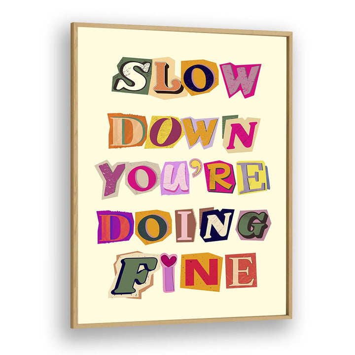 Colorful wall art featuring the phrase "SLOW DOWN YOU'RE DOING FINE," perfect for any home decor.
