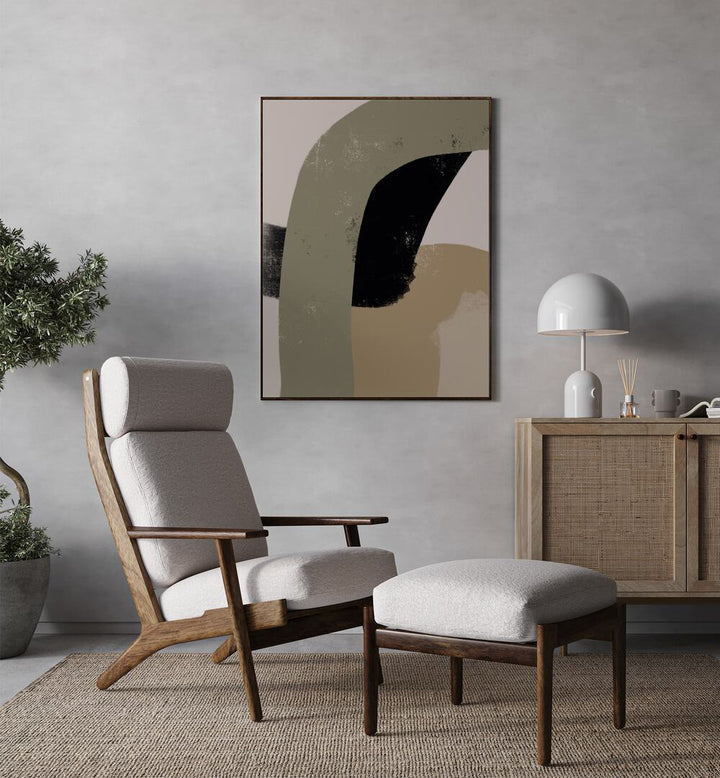 Obviam by Yopie Studio Abstract Paintings Abstract Art Prints in Black Plain Frame placed on a wall between a console table and a plant behind a chair