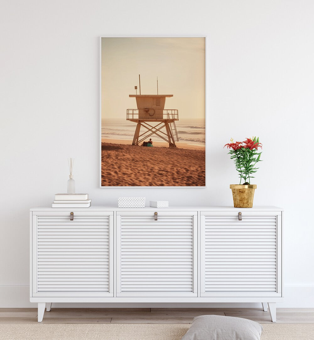 Serene sunset scene with a lifeguard tower, perfect for OCEANFRONT, BEACH PAINTINGS by Philippe Hugonnard.