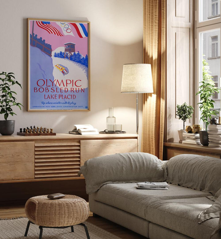 Olymic Bobsled Run Retro Vintage Travel Vintage Travel Posters in Oak Wood Plain Frame on a wall above a console table beside a lamp