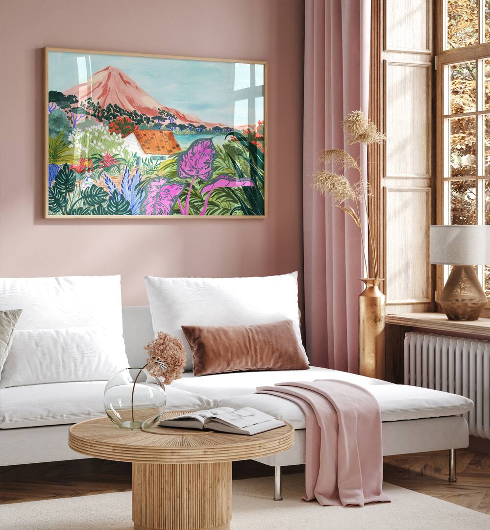 Ometepe By Sarah Gesek Landscape Art Prints in Oak Wood Plain Frame placed on a living room wall beside a window and behind a sofa