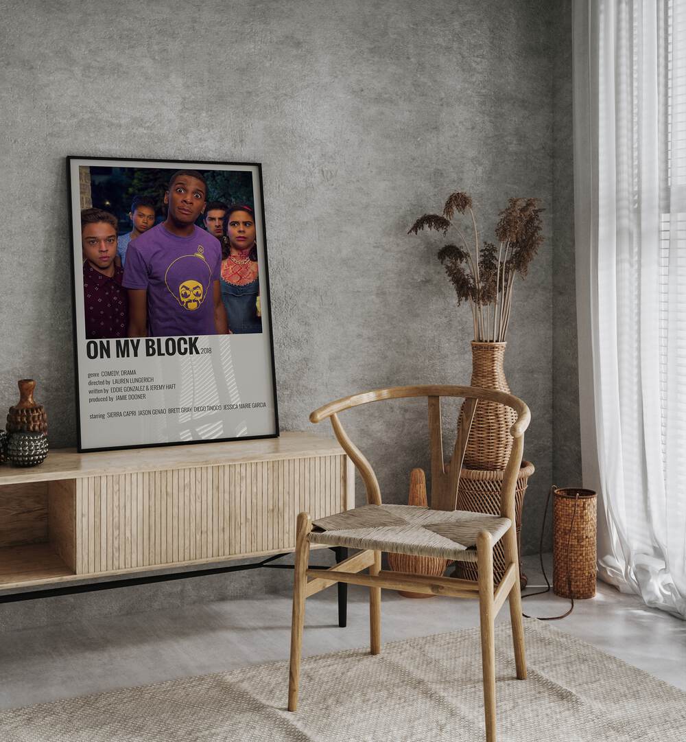 On My Block Movie Posters in Black Plain Frame placed on a console behind a chair