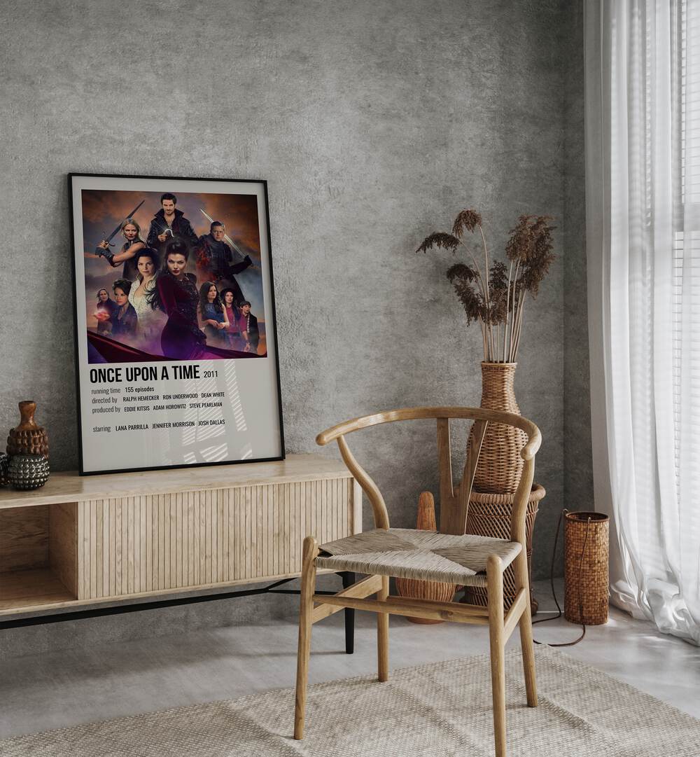 Once Upon A Time 2011 Movie Posters in Black Plain Frame placed on a table beside oakwood chair 
