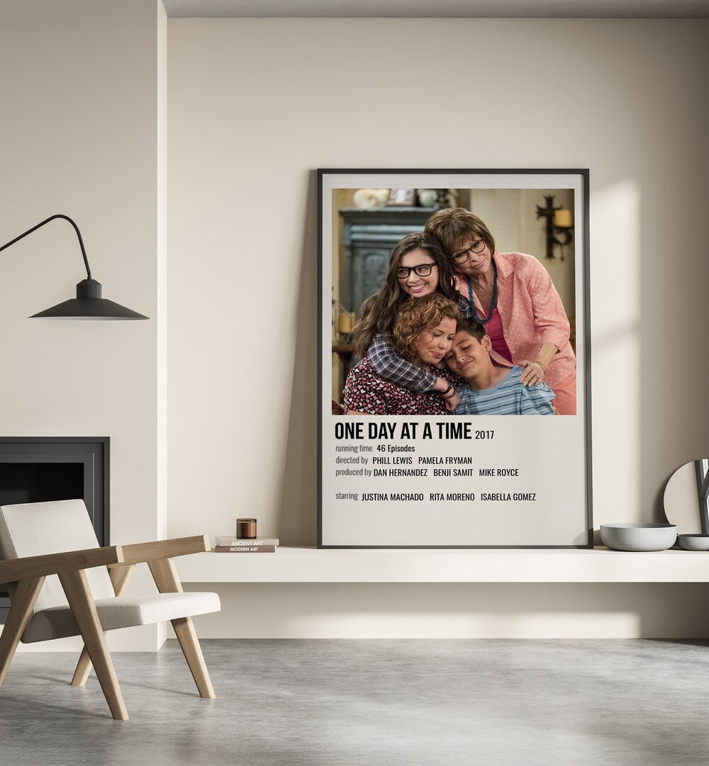 One Day At A Time 2017 Movie Posters in Black Plain Frame place on a wall behind a chair beside lamp