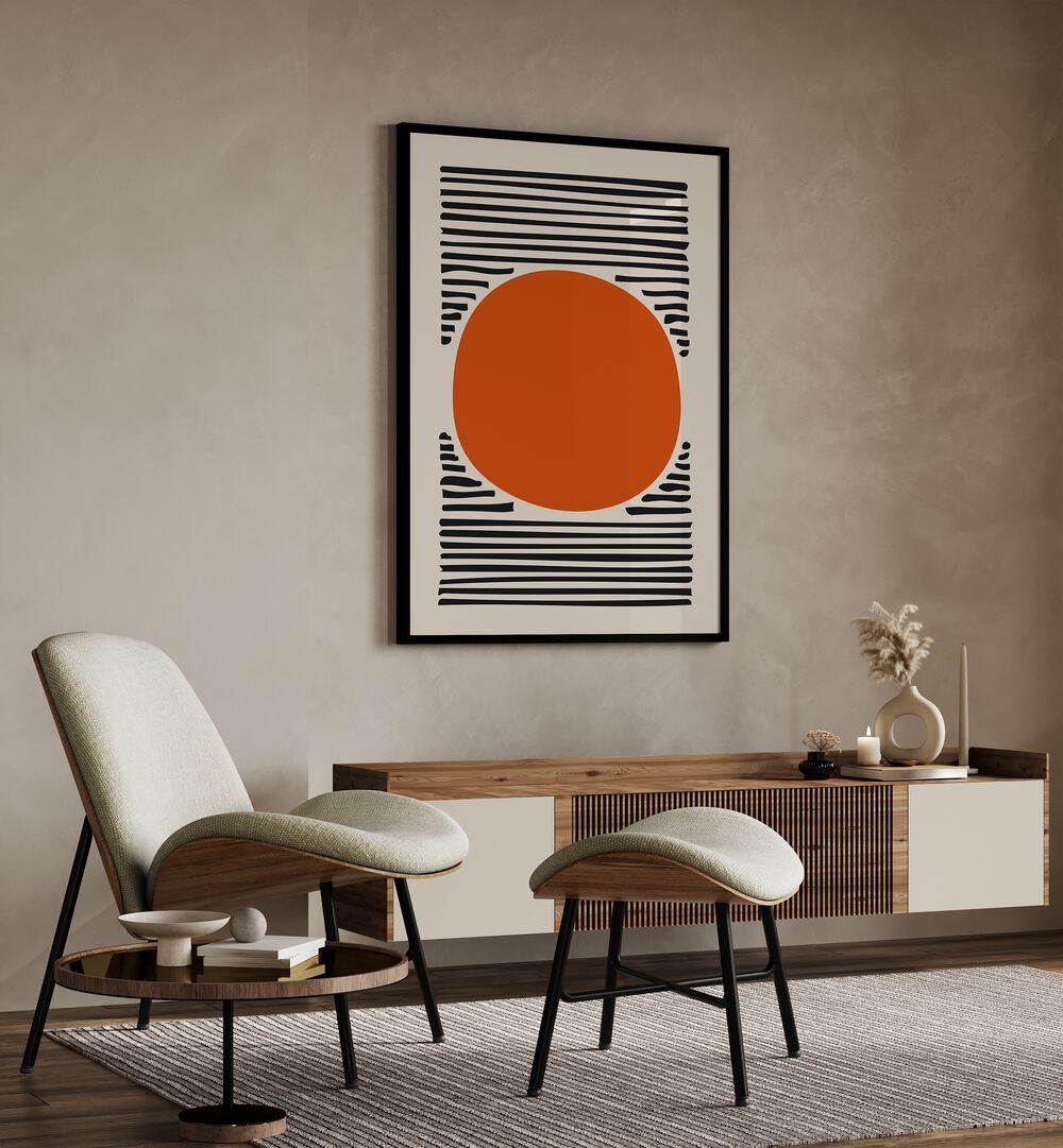 Orange Sun Abstract Paintings Abstract Art Prints in Black Plain Frame placed on a Beige Colored Wall above a Console Table in the Drawing Room