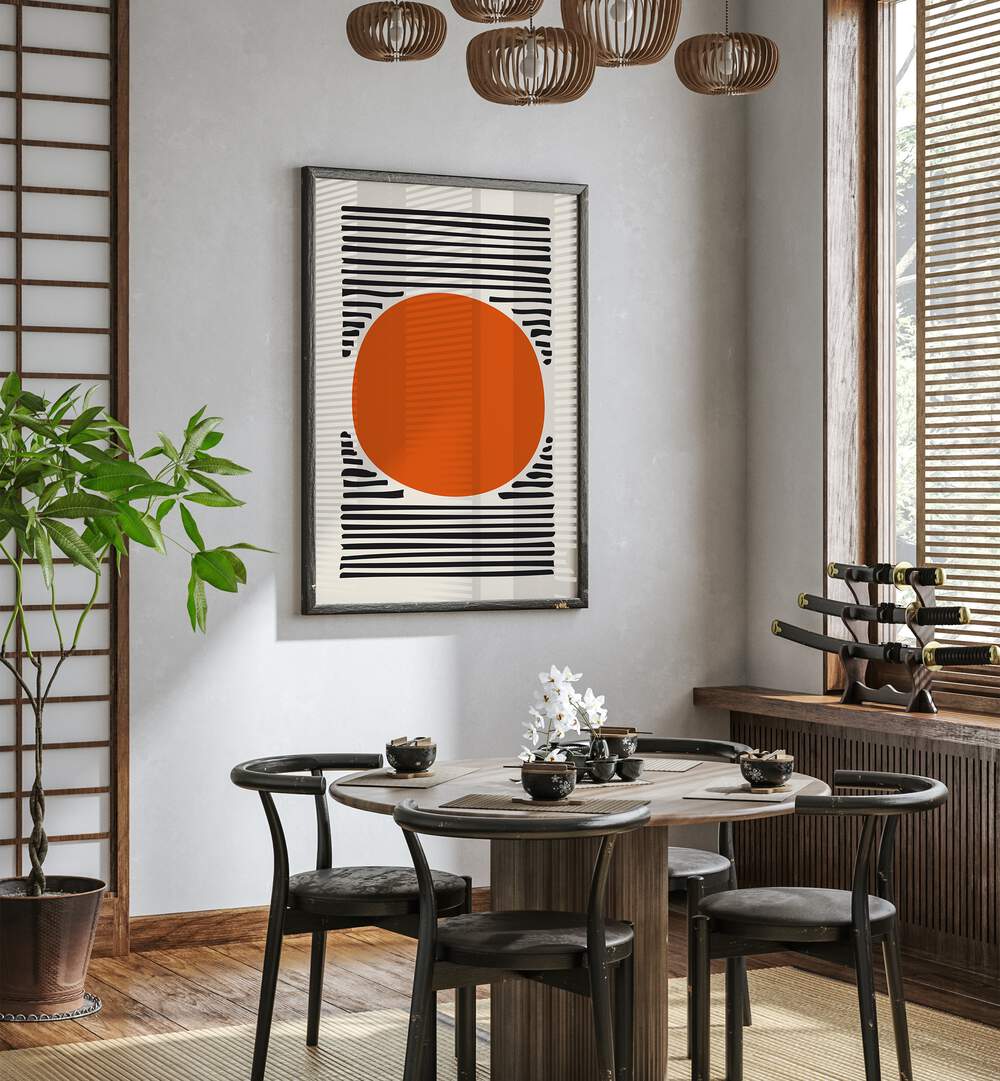 Orange Sun Abstract Paintings Abstract Art Prints in Dark Wood Plain Frame placed on a White Colored Wall near a Coffee Table in the Dining Room