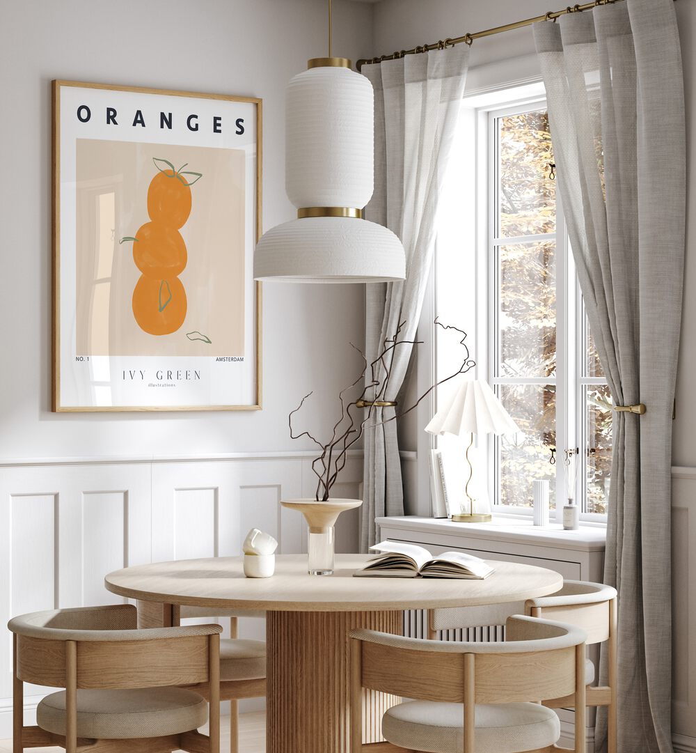 Oranges By Ivy Green Kitchen Art Prints in Oak Wood Plain Frame on a white wall behind a dining area beside a window for dining area 