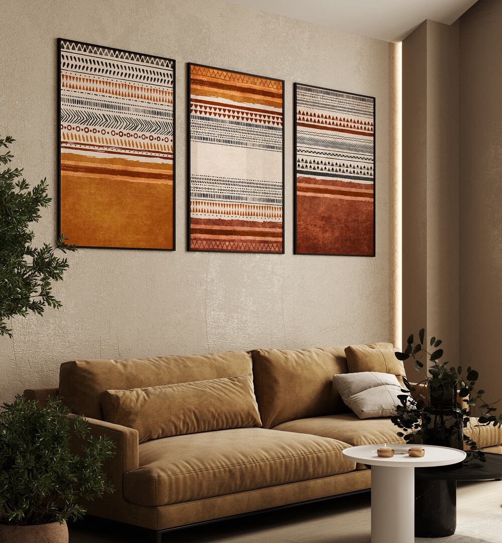 Organic Rug Patterns Set Of 3 Paintings in Black Plain Frame placed on a living room wall behind a sofa